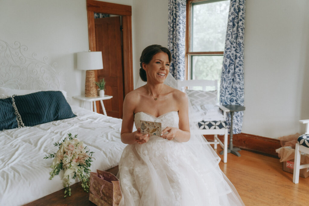 Bride reading a note from her groom on her wedding day.
