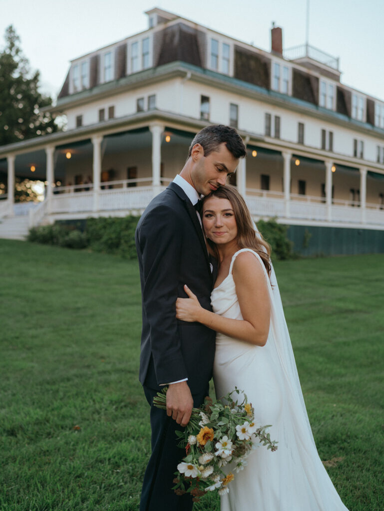 Couple hugging on their wedding day in Vermont.