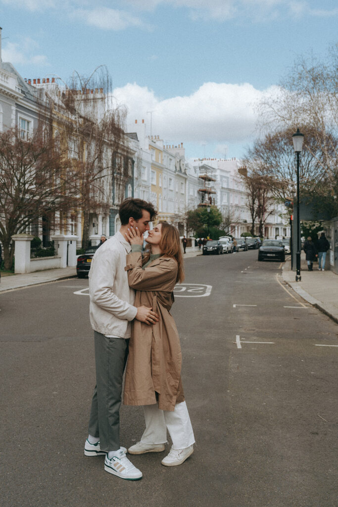 Couple kissing in the streets of Notting Hill in London.