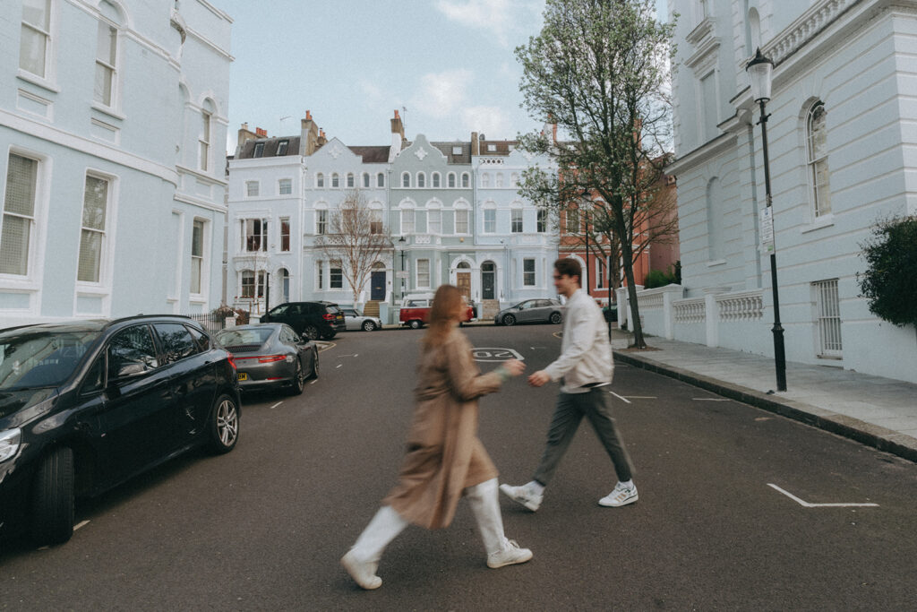 Couple running around streets of London.