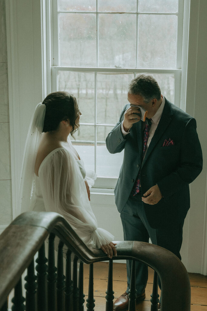 Bride's first look with her dad at the Peach Grove House before her Blooming Hill Farm wedding.