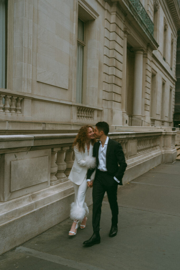 Couple walking through the streets of the Upper East Side in Manhattan, New York City