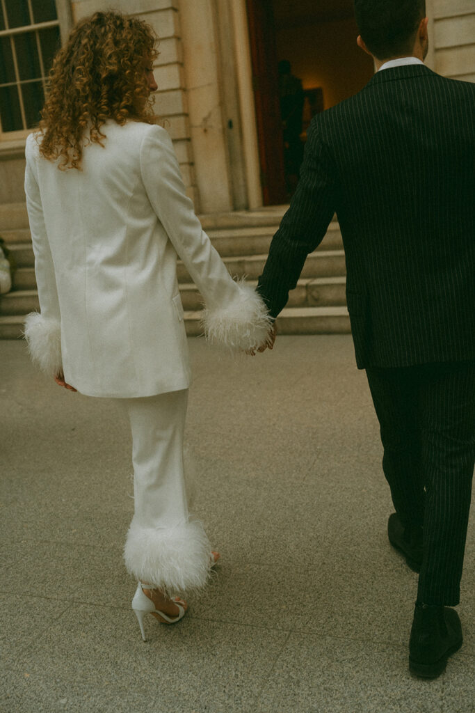 A white suit from Nadine Merabi, a perfect outfit for engagement photos