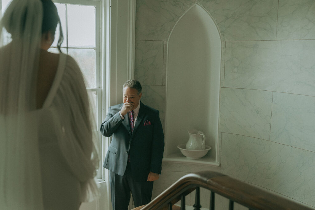 Bride's first look with her dad at the Peach Grove House before her Blooming Hill Farm wedding.