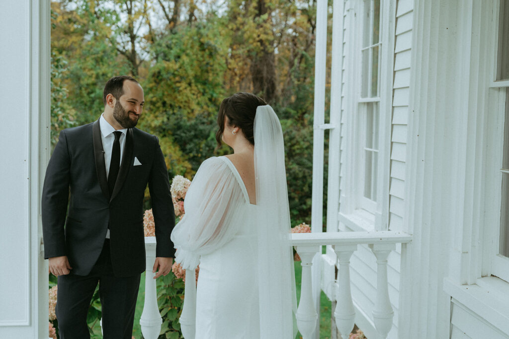 Bride and groom's first look at the Peach Grove House before their Blooming Hill Farm wedding.