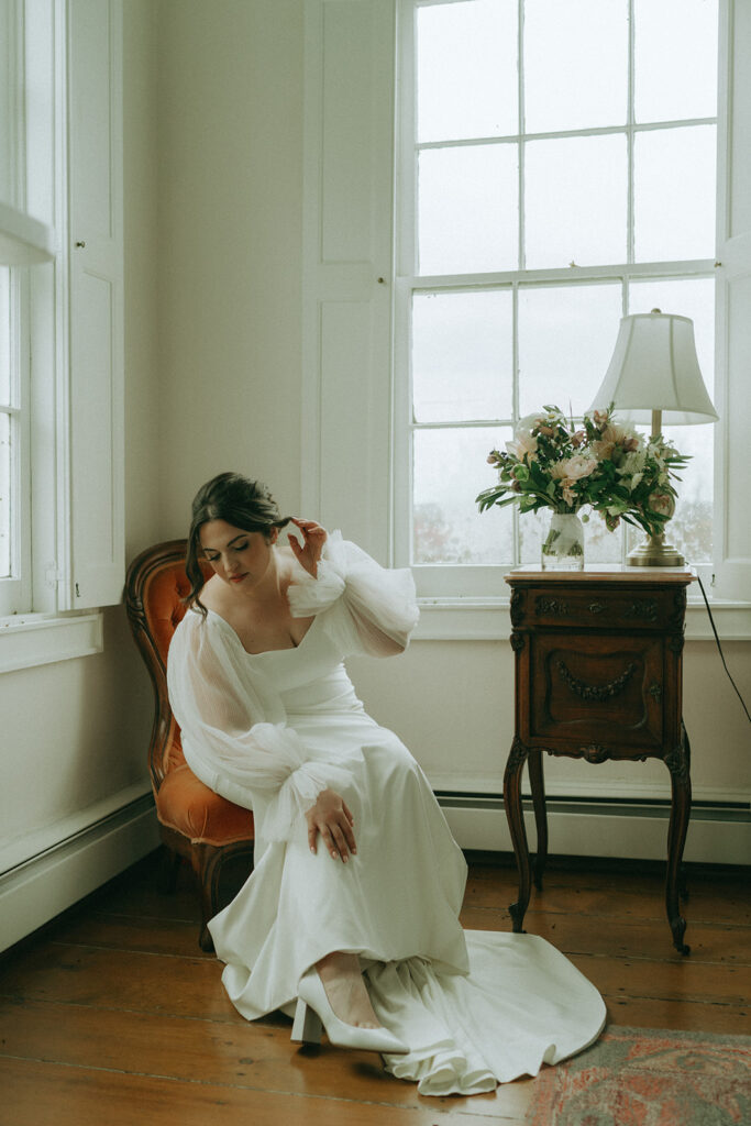 Bride getting ready at the Peach Grove House for a Blooming Hill Farm wedding.