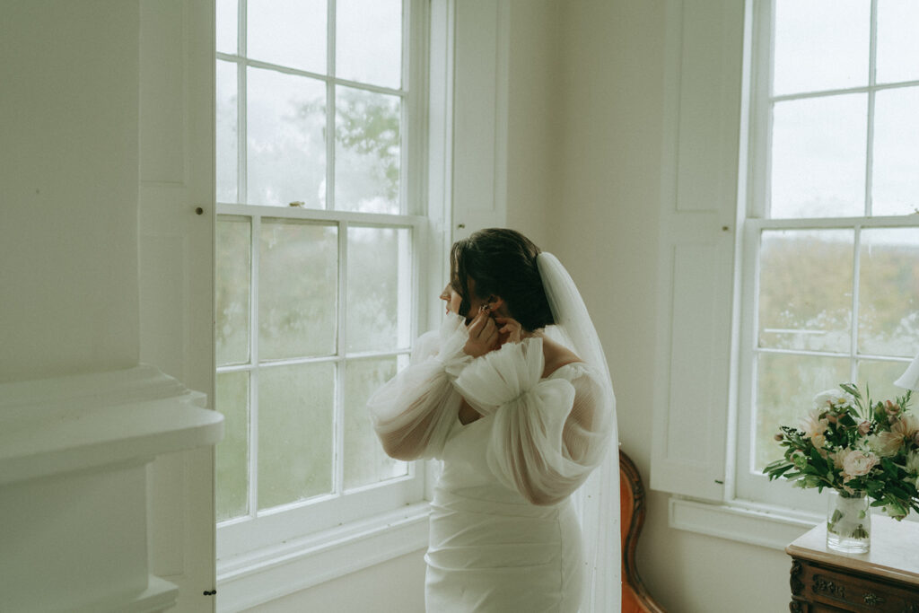 Bride getting ready at the Peach Grove House for a Blooming Hill Farm wedding.