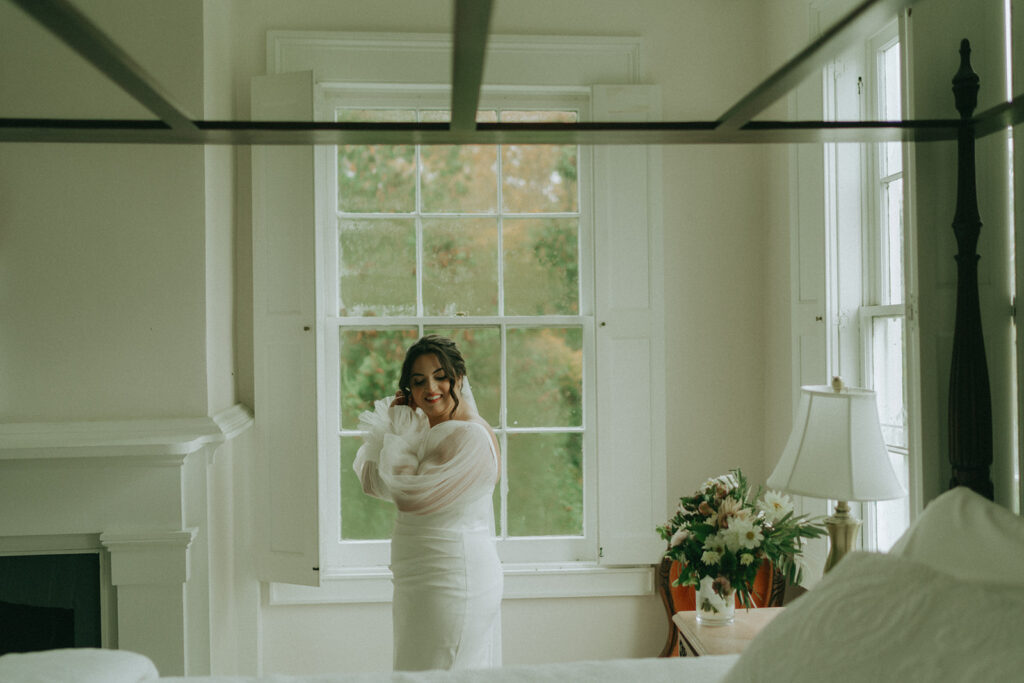 Bride getting ready at the Peach Grove House for a Blooming Hill Farm wedding.