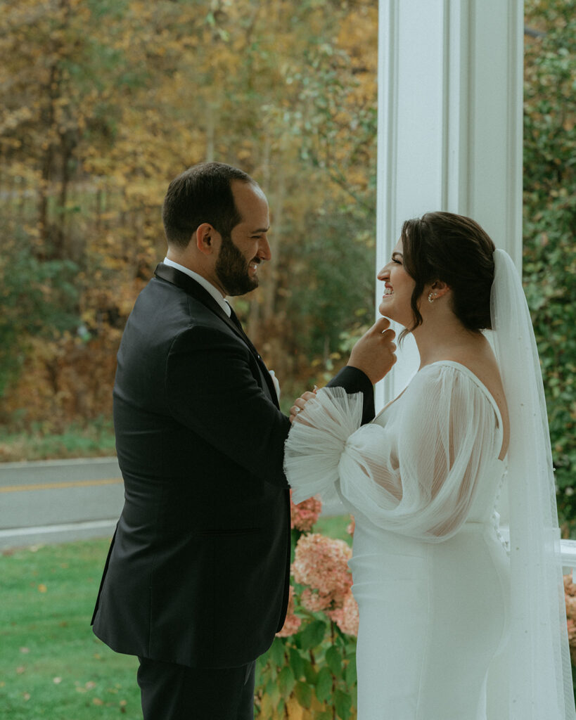 Bride and groom's first look at the Peach Grove House before their Blooming Hill Farm wedding.