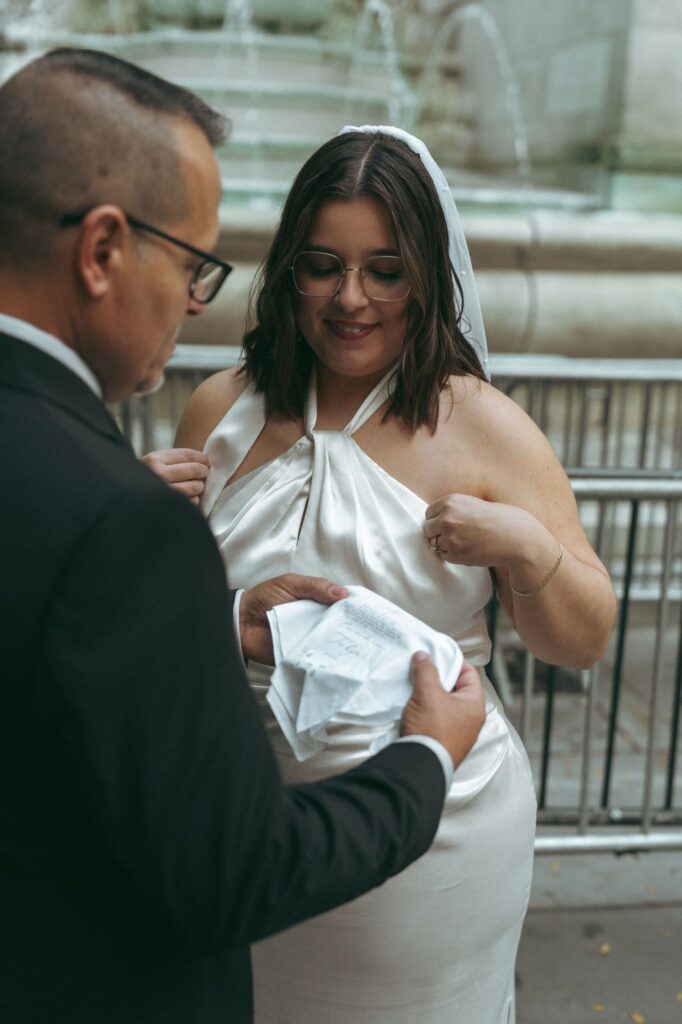 Bride and her father share an moment together before a New York Public Library elopement, by Elsie Goodman.