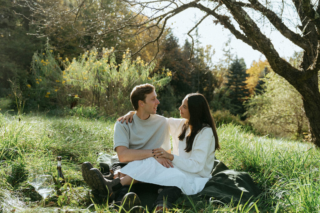 Vermont engagement photo of a couple in a field, by Elsie Goodman Photography.