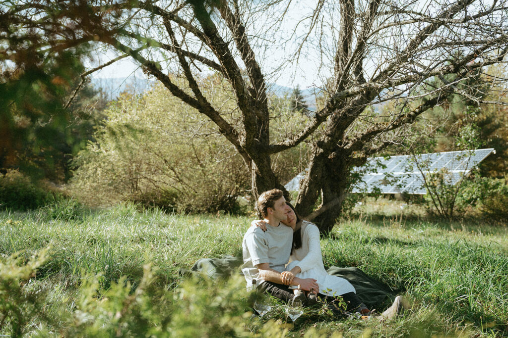 Vermont engagement picnic photo with head on shoulder, by Elsie Goodman Photography.