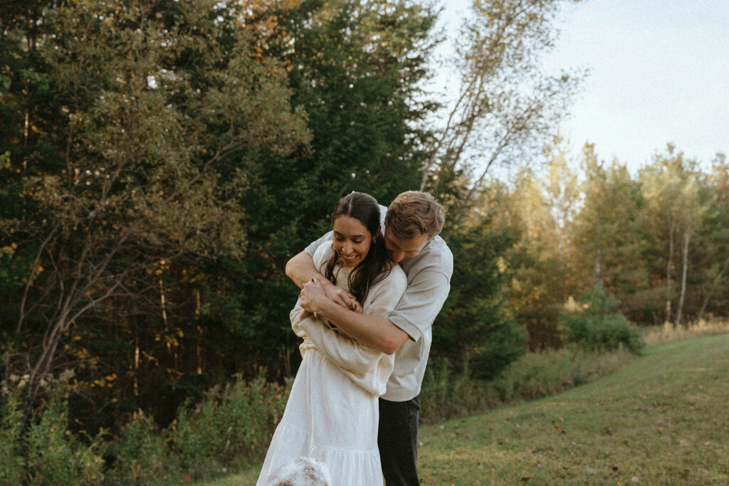 Vermont couples session candid hug, by Elsie Goodman Photography.