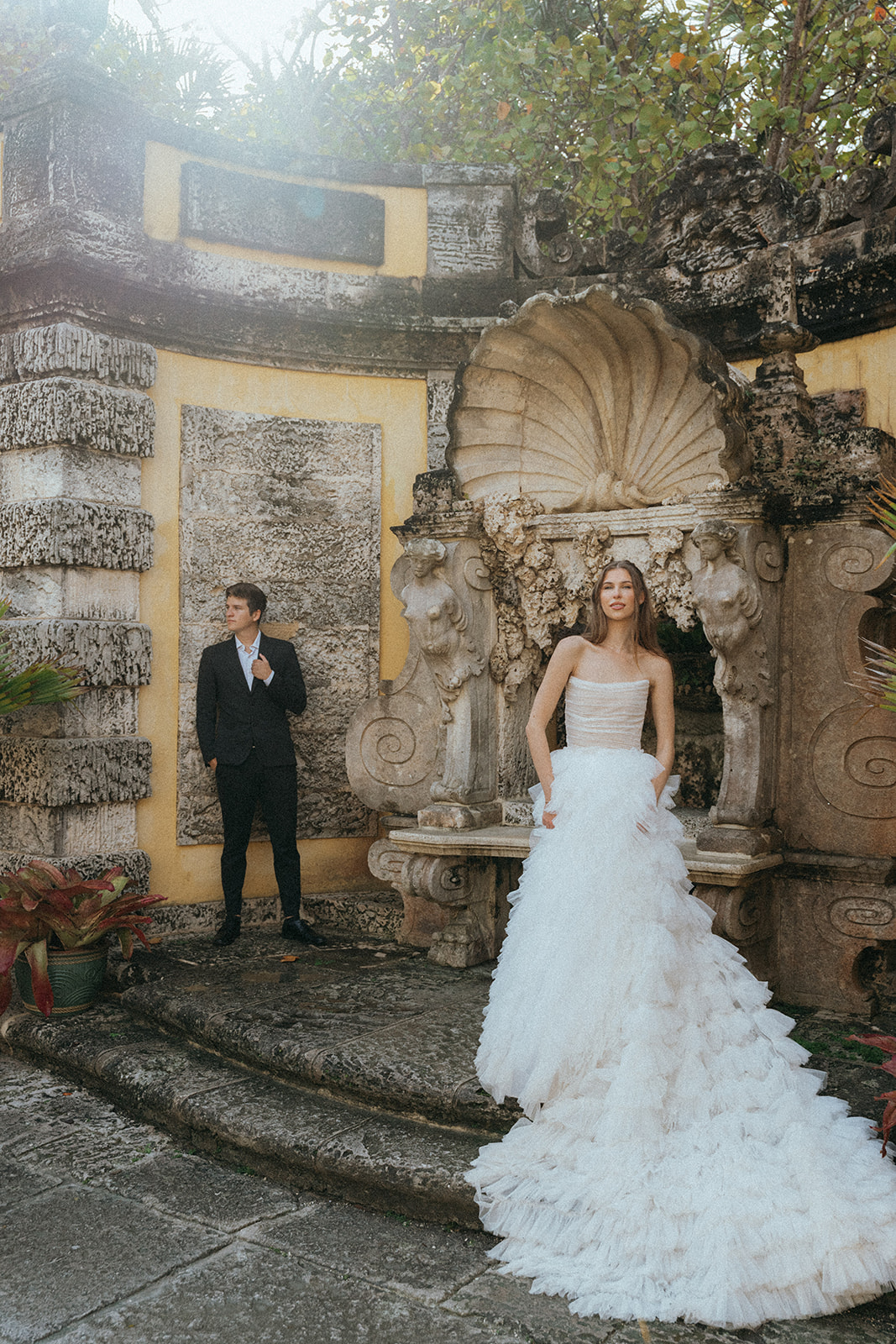 Viscaya Bride and groom in front of a fountain by Vizcaya Wedding Photographer Elsie Goodman.