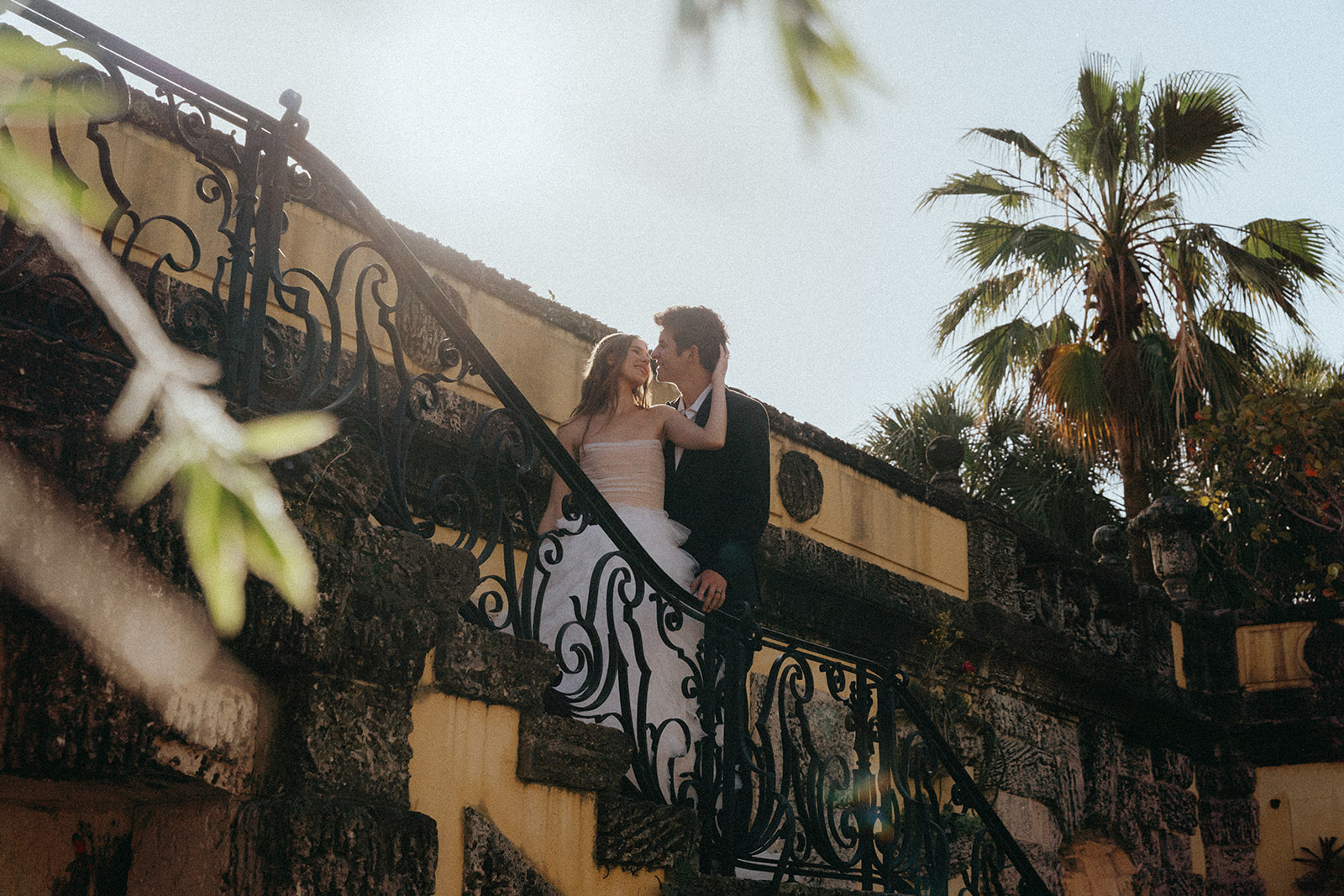 Viscaya Bride and groom on an outdoor stairway by Vizcaya Wedding Photographer Elsie Goodman.