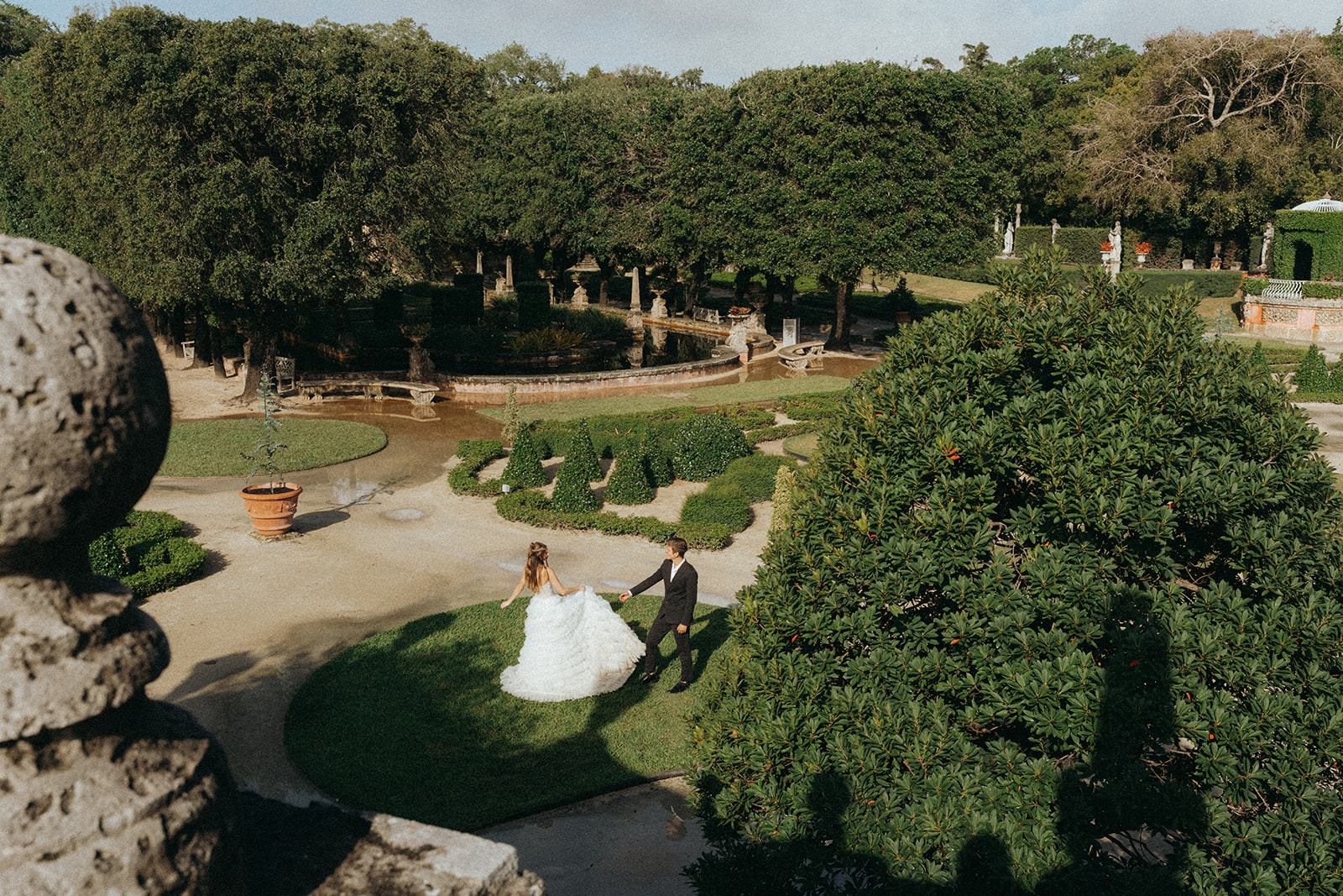 Viscaya bride and groom dancing on the grass by Vizcaya Wedding Photographer Elsie Goodman.