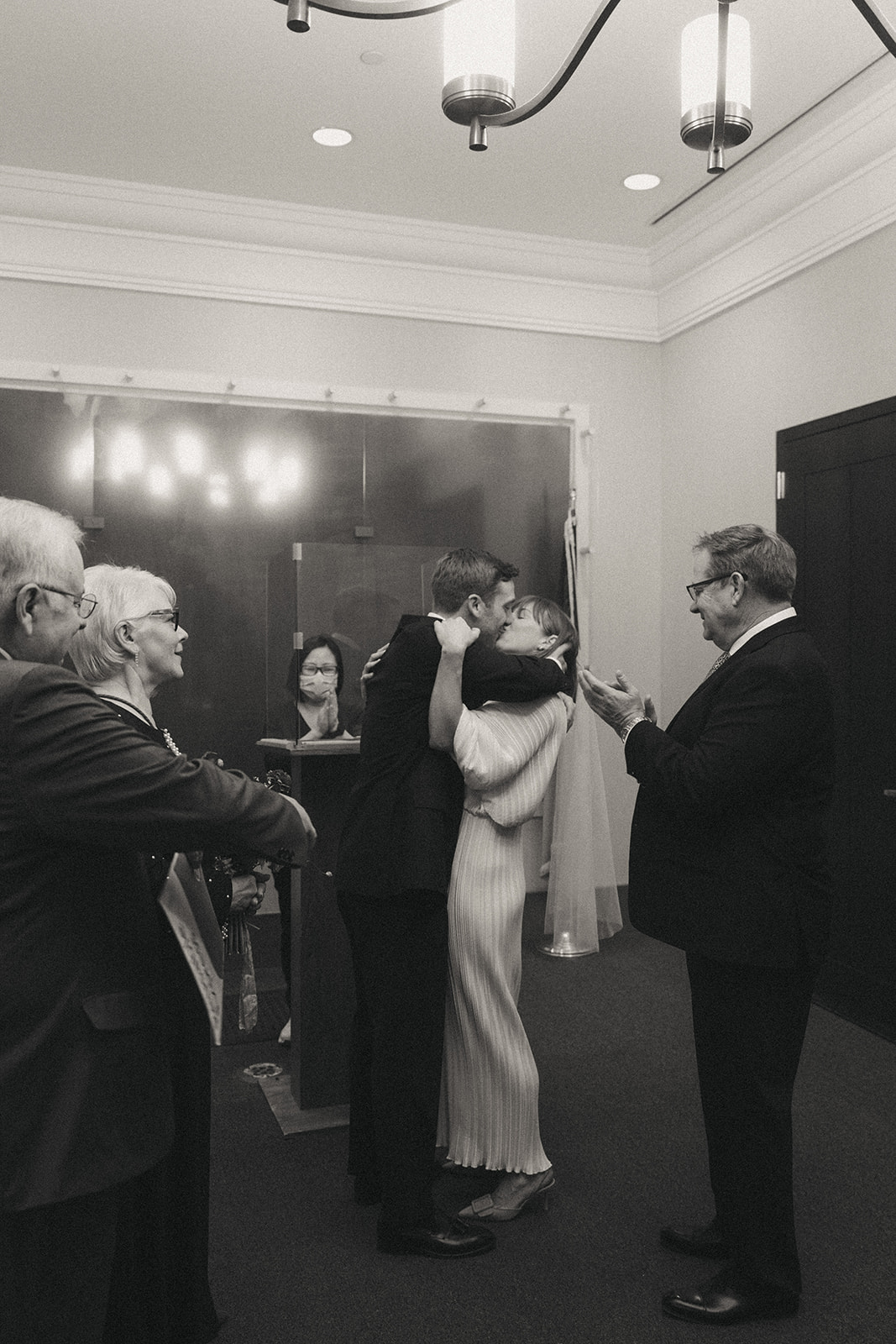 Rachel and Dave’s 2 day celebration Black and white photo of the bride and groom kissing at the alter by NYC city hall wedding photographer Elsie Goodman.