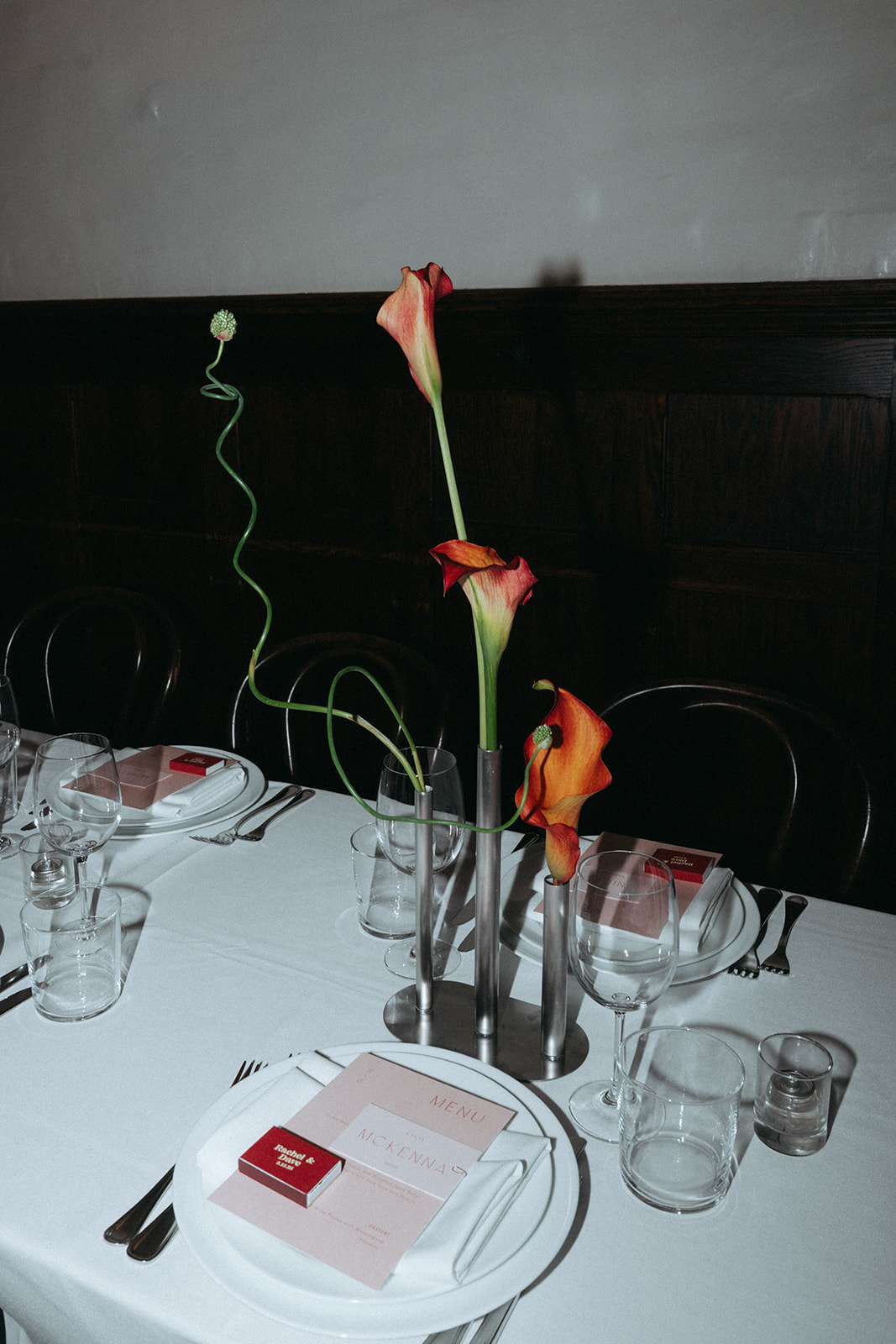 Rachel and Dave’s 2 day celebration Full table shot of the flowers, table setting and menus for the wedding dinner and reception at Franks in NYC signs her guest book, which is a deck of cards at Franks restaurant in NYC by NYC elopement photographer Elsie Goodman.