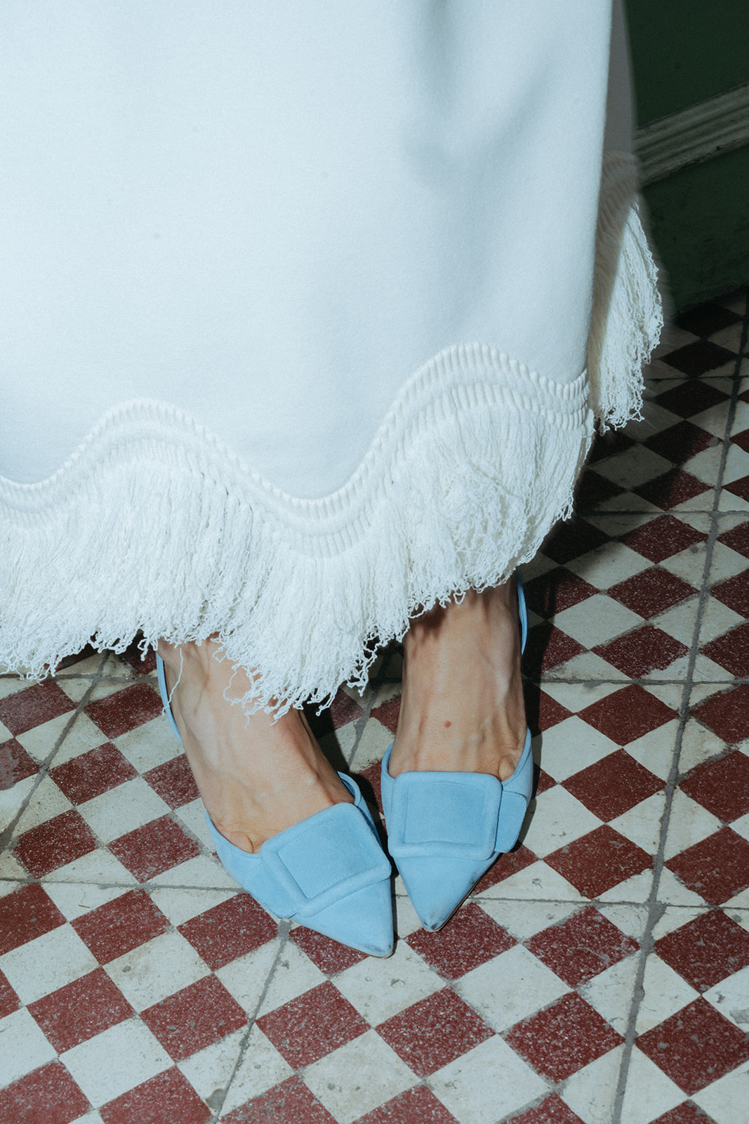 Rachel and Dave’s 2 day celebration Flash-photo of the brides white vintage dress and blue shoes by NYC elopement photographer Elsie Goodman.