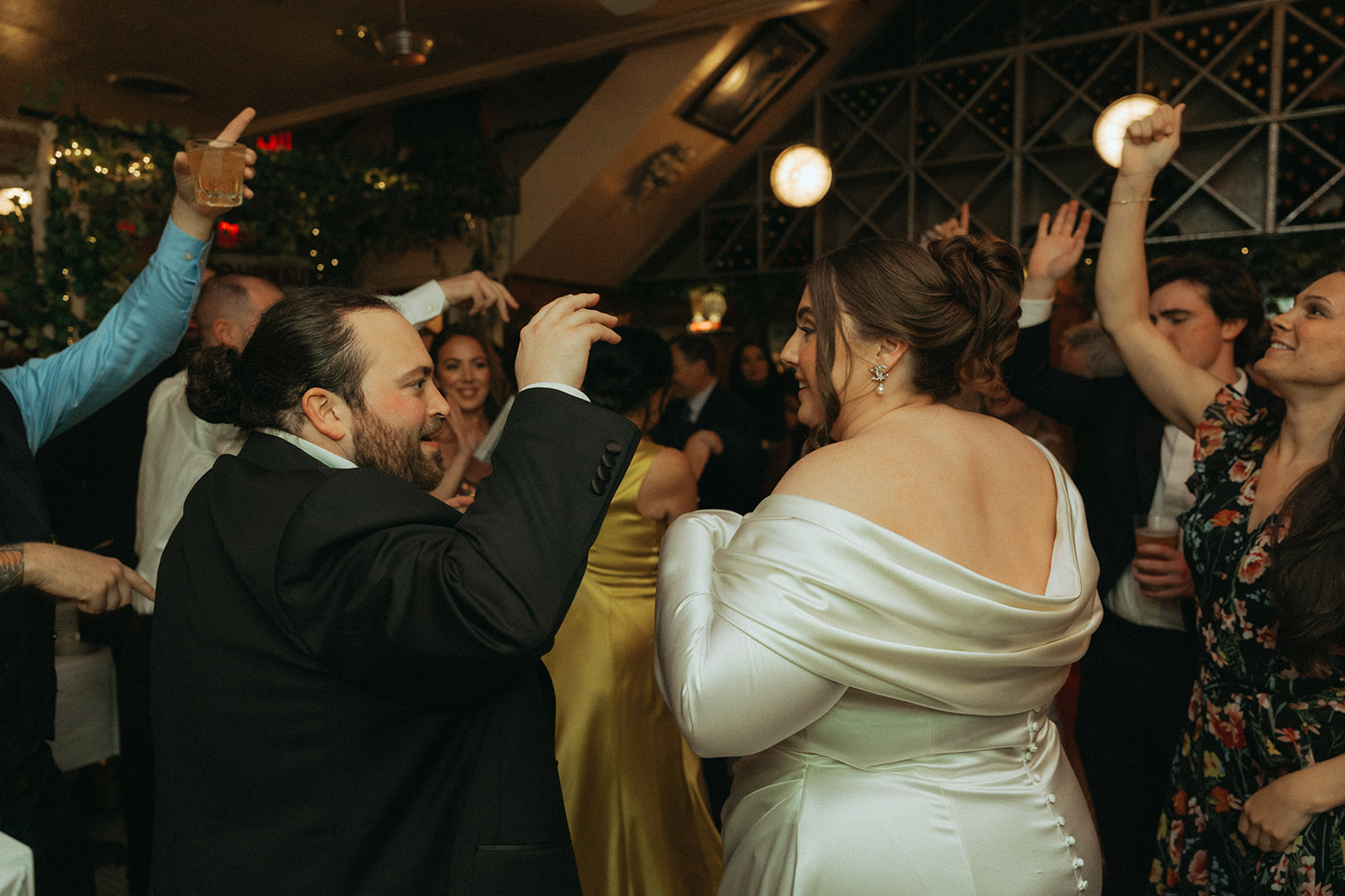 Madison + Dylan 620 Loft and Garden Wedding bride and groom dancing with friends at wedding reception at Juliette’s in nyc, shot by elsie goodman, a destination and NYC wedding photographer