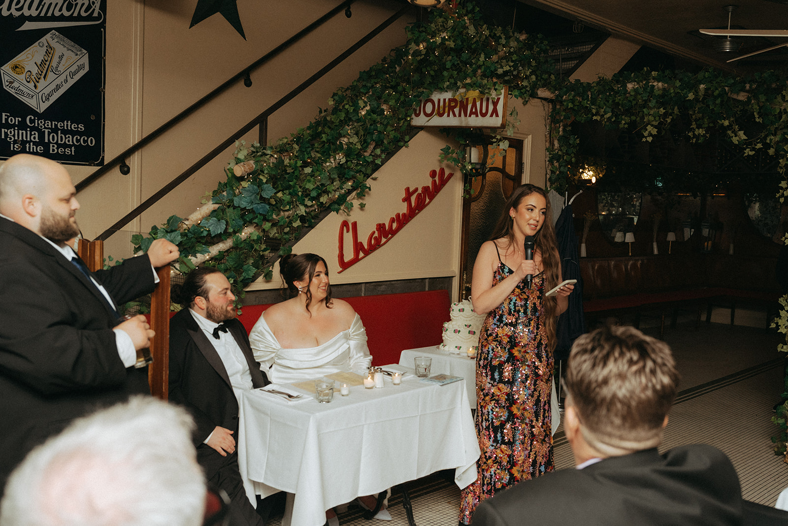 Madison + Dylan 620 Loft and Garden Wedding bride and groom listening to speech at wedding reception, shot by elsie goodman, a destination and NYC wedding photographer