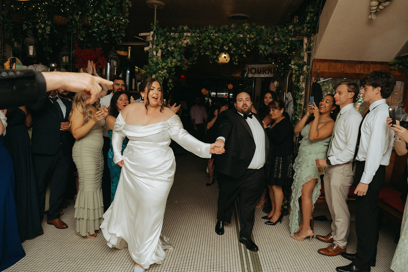 Madison + Dylan 620 Loft and Garden Wedding bride and groom entering their wedding reception at Juliette’s in nyc, shot by elsie goodman, a destination and NYC wedding photographer