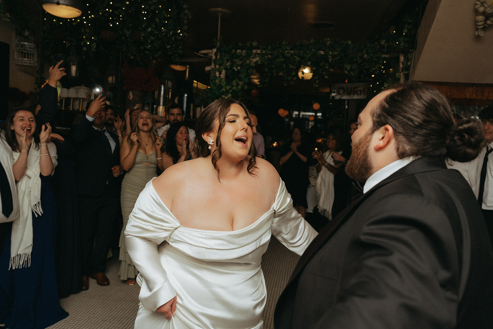 Madison + Dylan 620 Loft and Garden Wedding bride singing to groom at wedding reception at Juliette’s in nyc, shot by elsie goodman, a destination and NYC wedding photographer