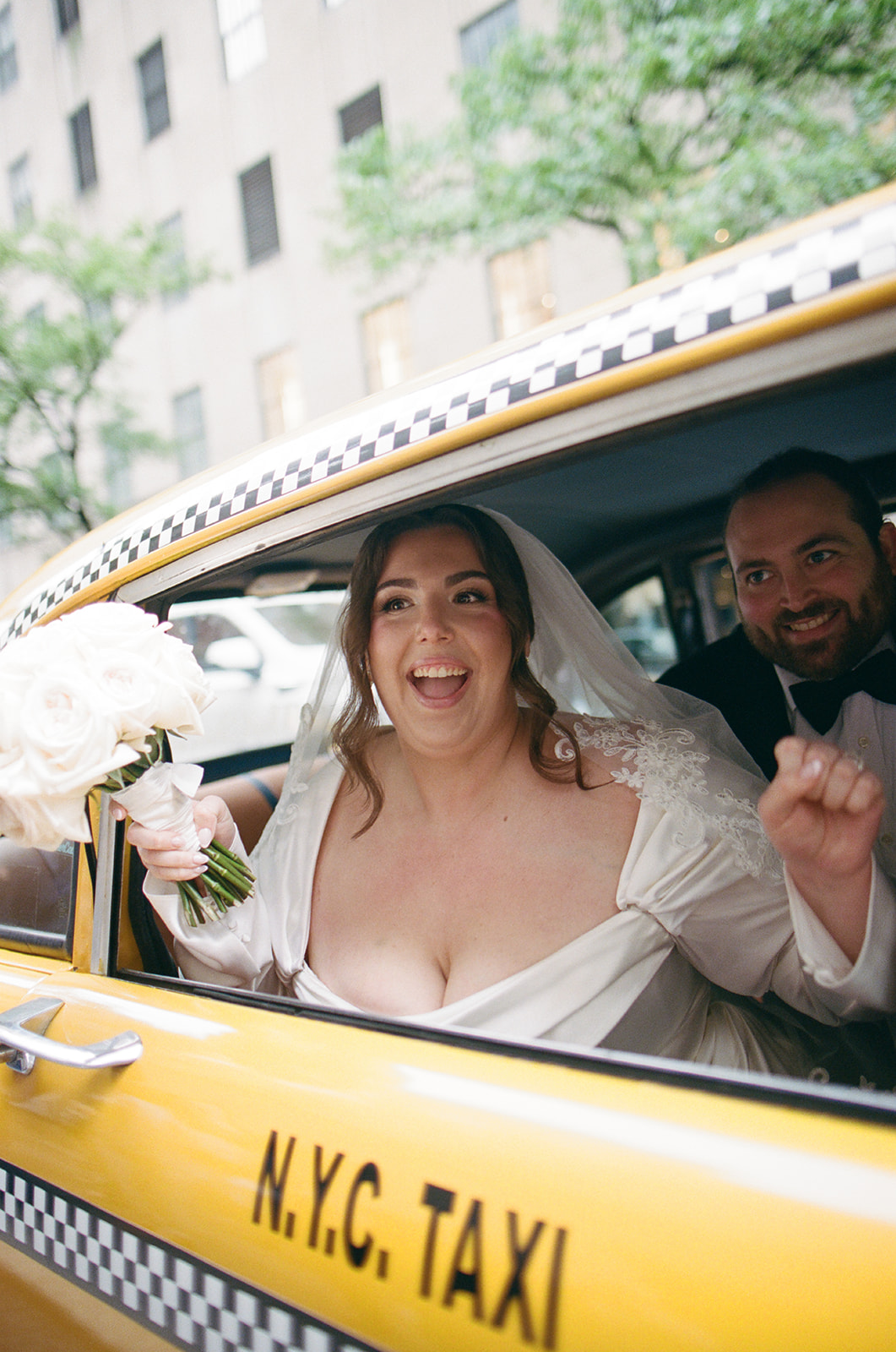 Madison + Dylan 620 Loft and Garden Wedding bride and grooms grand exit after 620 loft & garden wedding in a vintage taxi, shot by elsie goodman, a destination and NYC wedding photographer