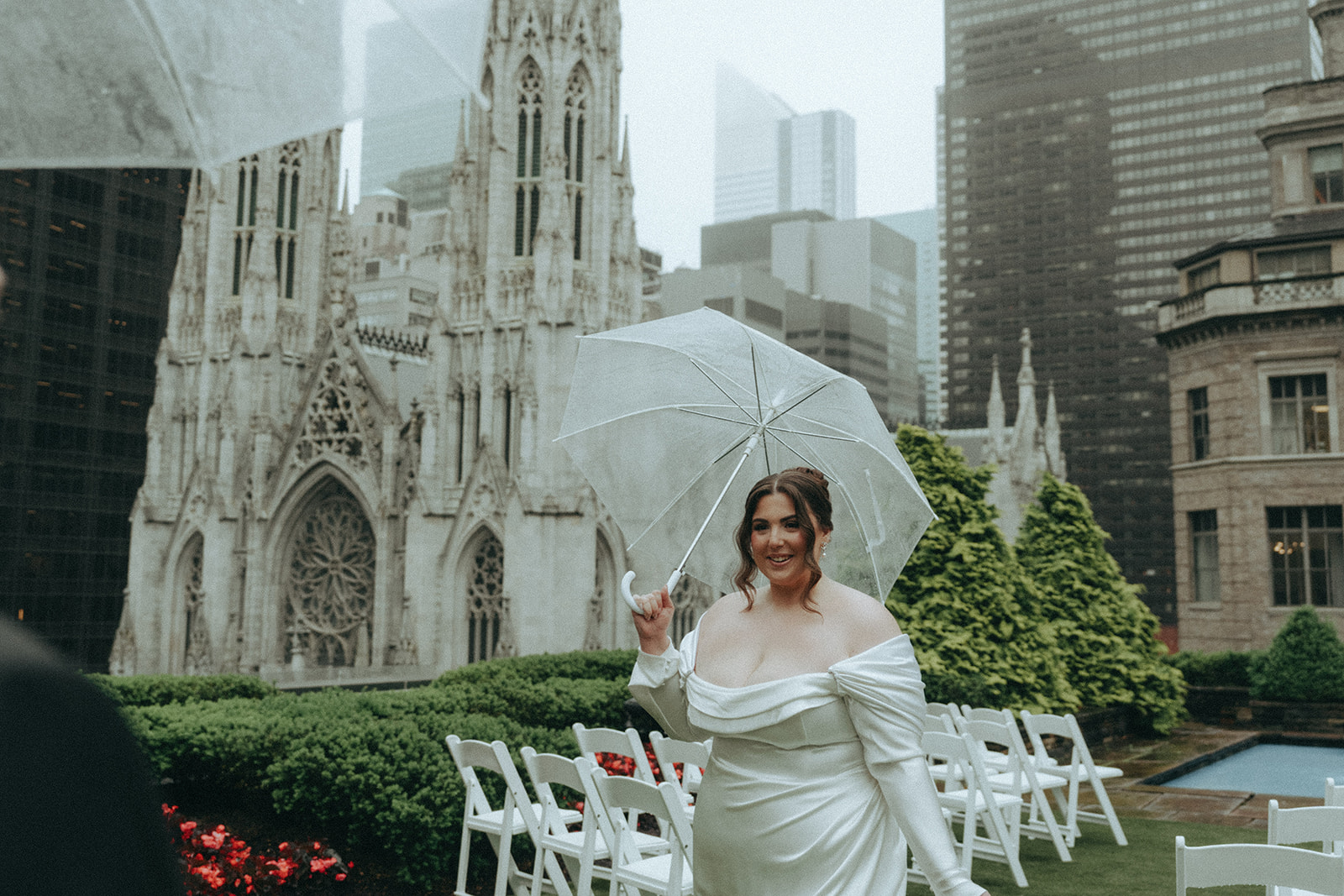 Madison + Dylan 620 Loft and Garden Wedding bride smiling at groom holding umbrella at 620 loft & garden wedding, shot by elsie goodman, a destination and NYC wedding photographer