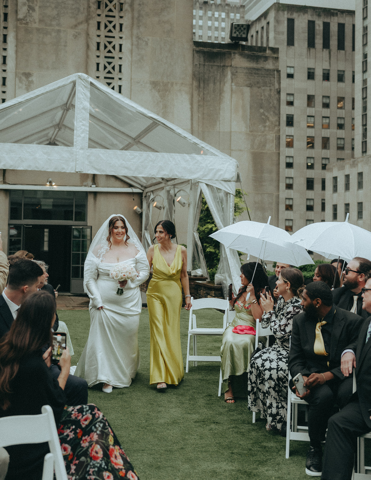Madison + Dylan 620 Loft and Garden Wedding bride walking down aisle with mom at 620 loft & garden wedding, shot by elsie goodman, a destination and NYC wedding photographer