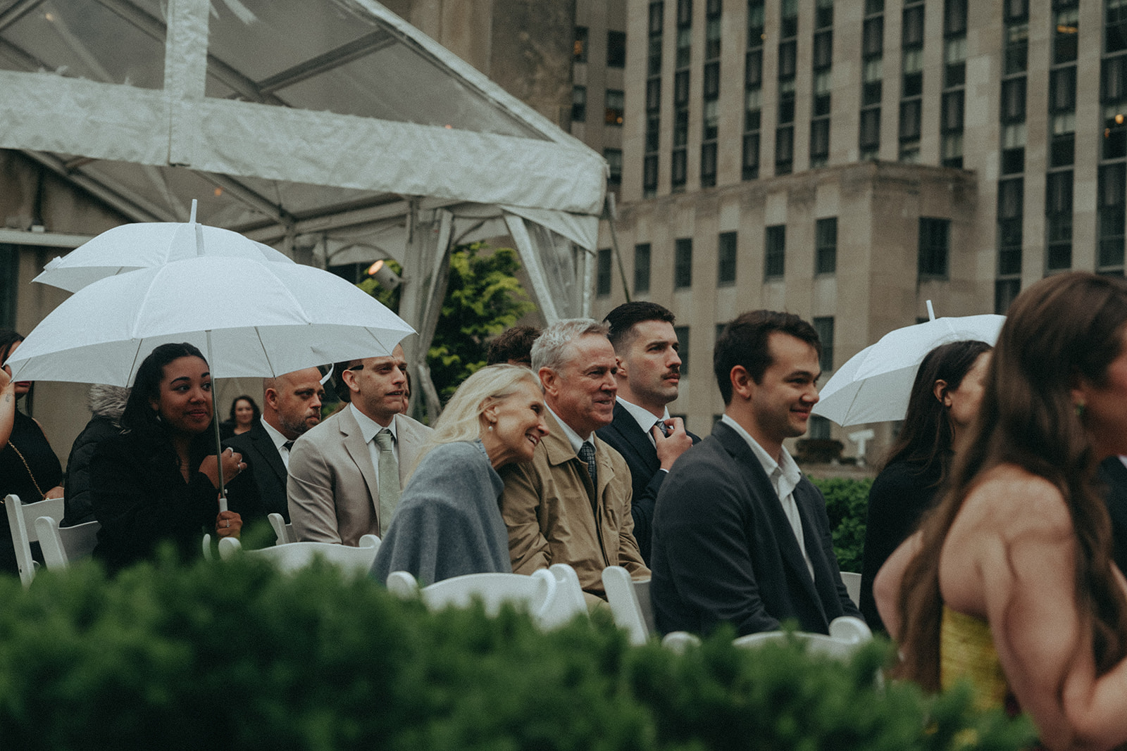 Madison + Dylan 620 Loft and Garden Wedding couple watching ceremony at 620 loft & garden wedding, shot by elsie goodman, a destination and NYC wedding photographer