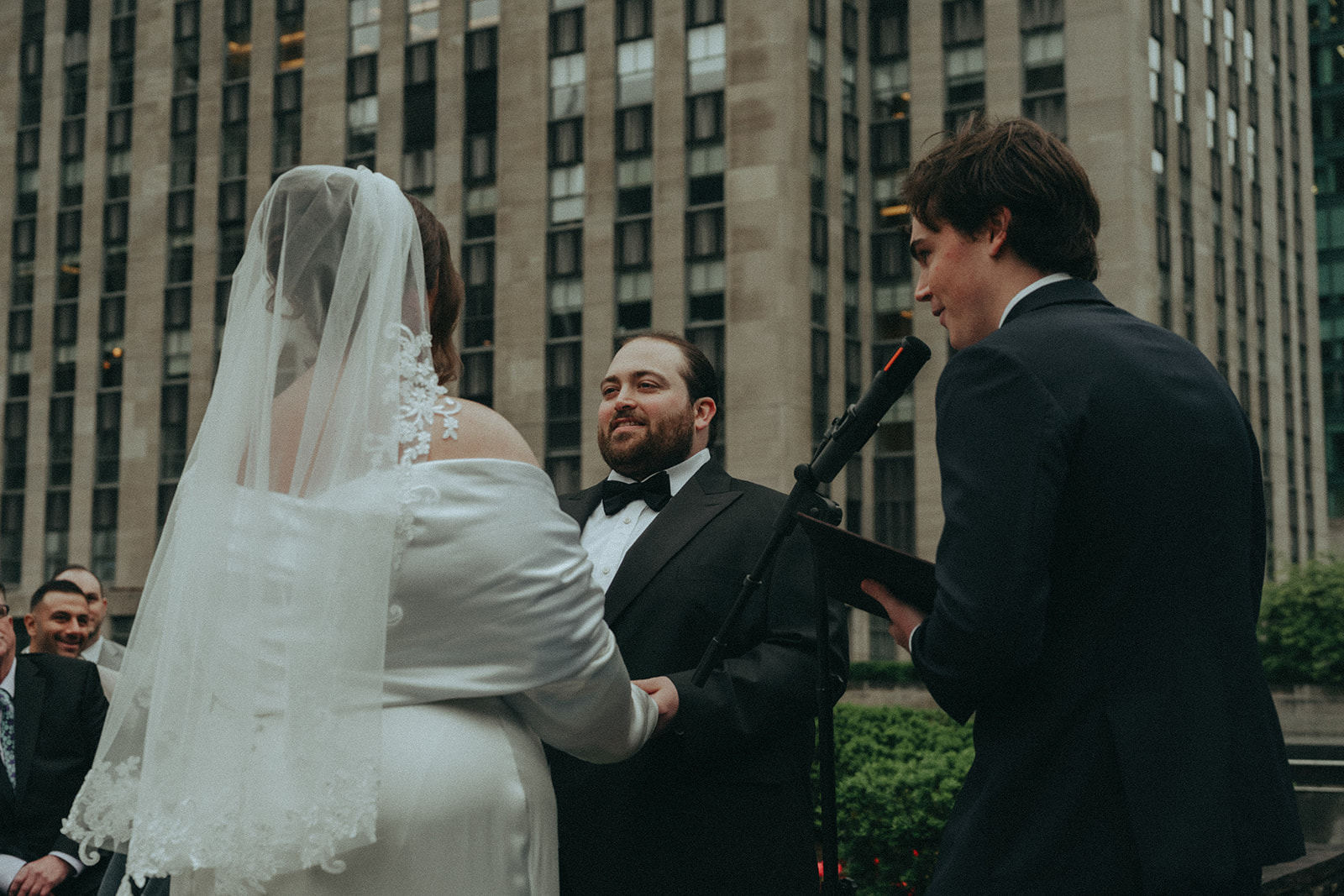 Madison + Dylan 620 Loft and Garden Wedding bride, groom, and officiant at 620 loft & garden wedding, shot by elsie goodman, a destination and NYC wedding photographer