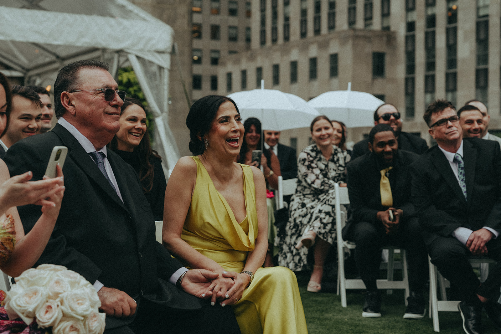 Madison + Dylan 620 Loft and Garden Wedding mother of the bride laughing during ceremony at 620 loft & garden wedding, shot by elsie goodman, a destination and NYC wedding photographer