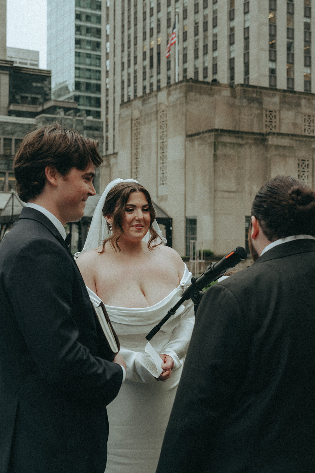 Madison + Dylan 620 Loft and Garden Wedding bride, groom, and officiant at 620 loft & garden wedding, shot by elsie goodman, a destination and NYC wedding photographer