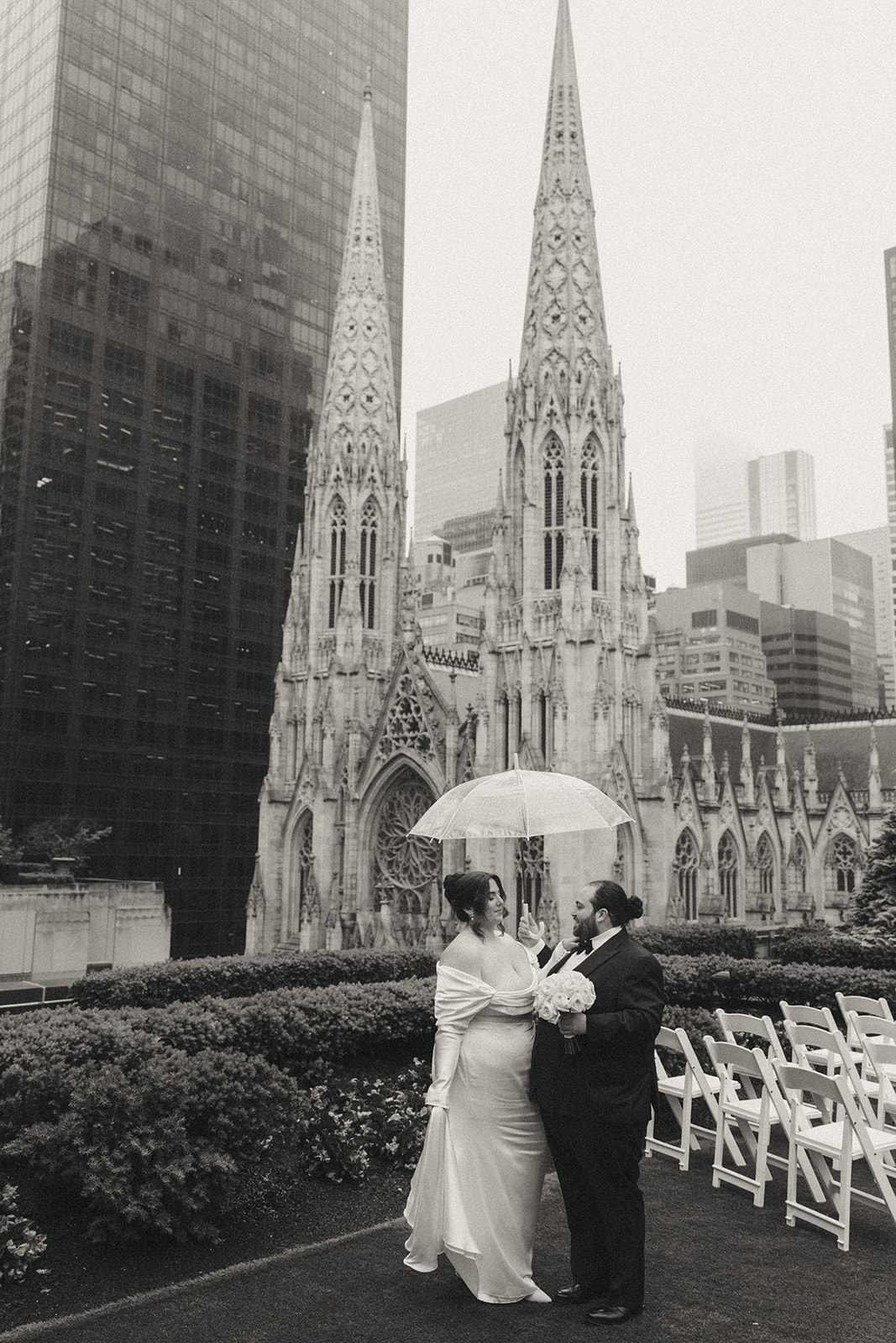 Madison + Dylan 620 Loft and Garden Wedding bride and groom holding umbrella on rooftop at 620 loft & garden wedding, shot by elsie goodman, a destination and NYC wedding photographer