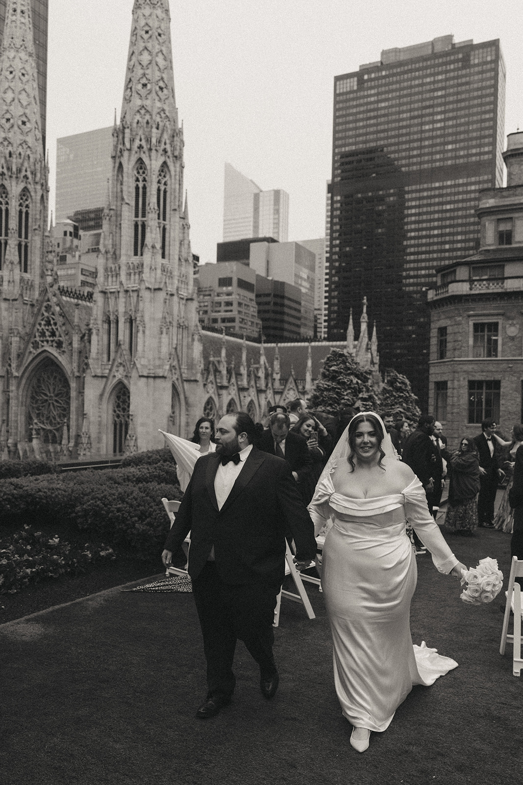 Madison + Dylan 620 Loft and Garden Wedding bride and groom exit ceremony at 620 loft & garden wedding, shot by elsie goodman, a destination and NYC wedding photographer