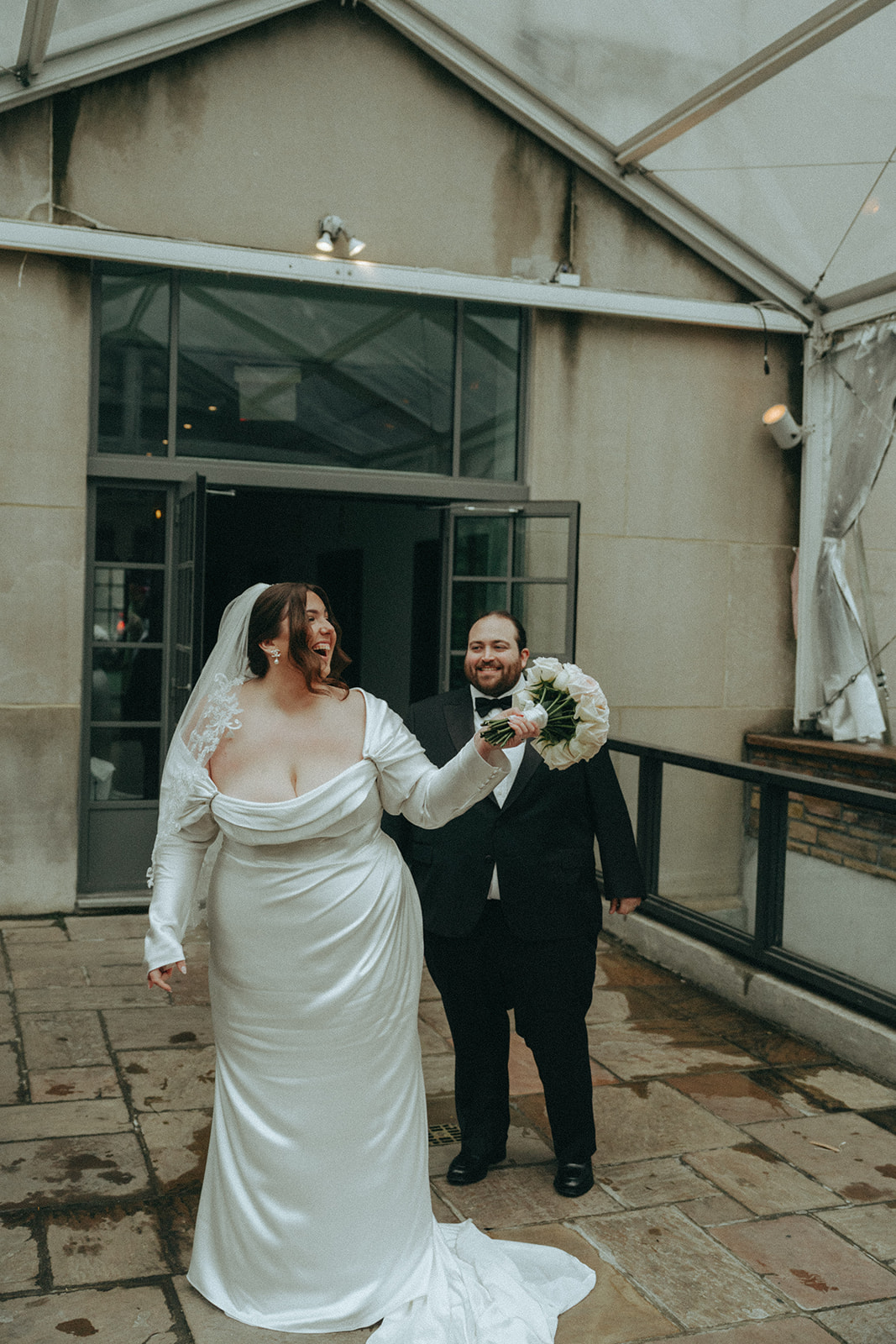 Madison + Dylan 620 Loft and Garden Wedding bride and groom laugh after ceremony at 620 loft & garden wedding, shot by elsie goodman, a destination and NYC wedding photographer