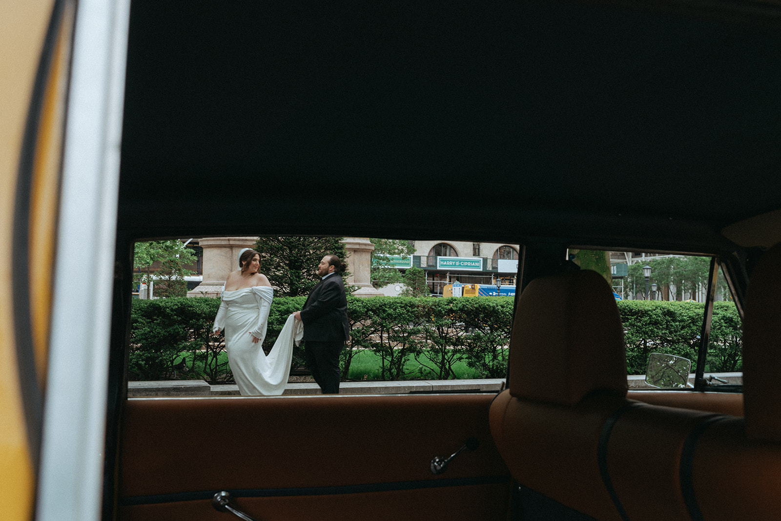 Madison + Dylan 620 Loft and Garden Wedding bride and groom shot from a taxi window after 620 loft & garden wedding, shot by elsie goodman, a destination and NYC wedding photographer