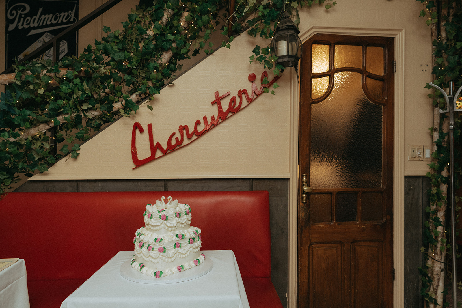 Madison + Dylan 620 Loft and Garden Wedding Vintage tiered cake at wedding reception at Juliette’s in nyc, shot by elsie goodman, a destination and NYC wedding photographer