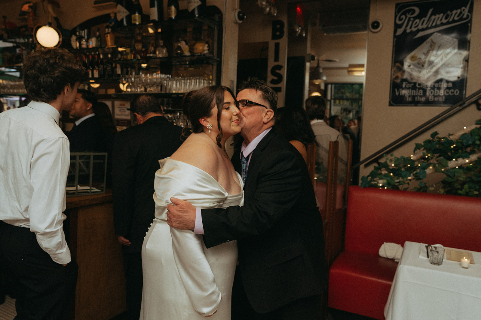 Madison + Dylan 620 Loft and Garden Wedding loved one kissing bride at wedding reception at Juliette’s in nyc, shot by elsie goodman, a destination and NYC wedding photographer