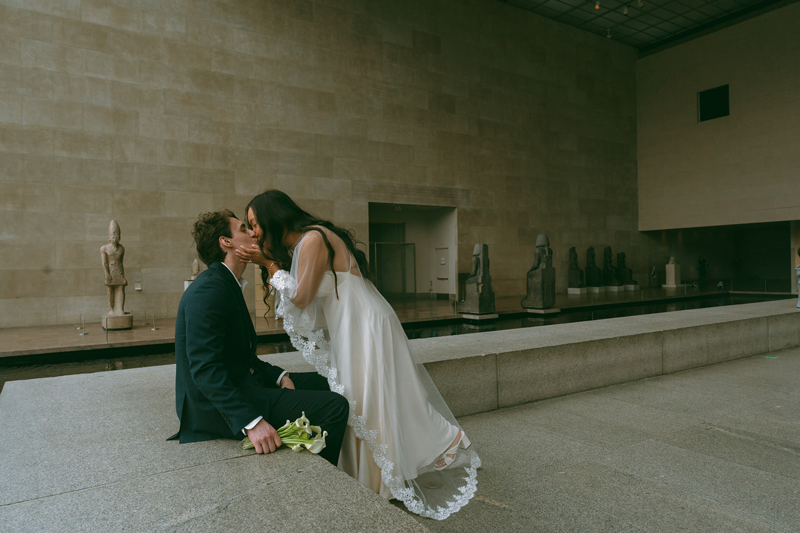 Alex + Bardo NYC Elopement Photos bride and groom kissing at the Met shot by elsie goodman, a destination, wedding and NYC elopement photographer