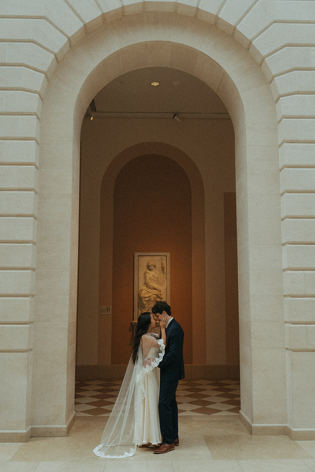 Alex + Bardo NYC Elopement Photos bride and groom posing under arch at the Met for elopement photos, shot by elsie goodman, a destination, wedding and NYC elopement photographer