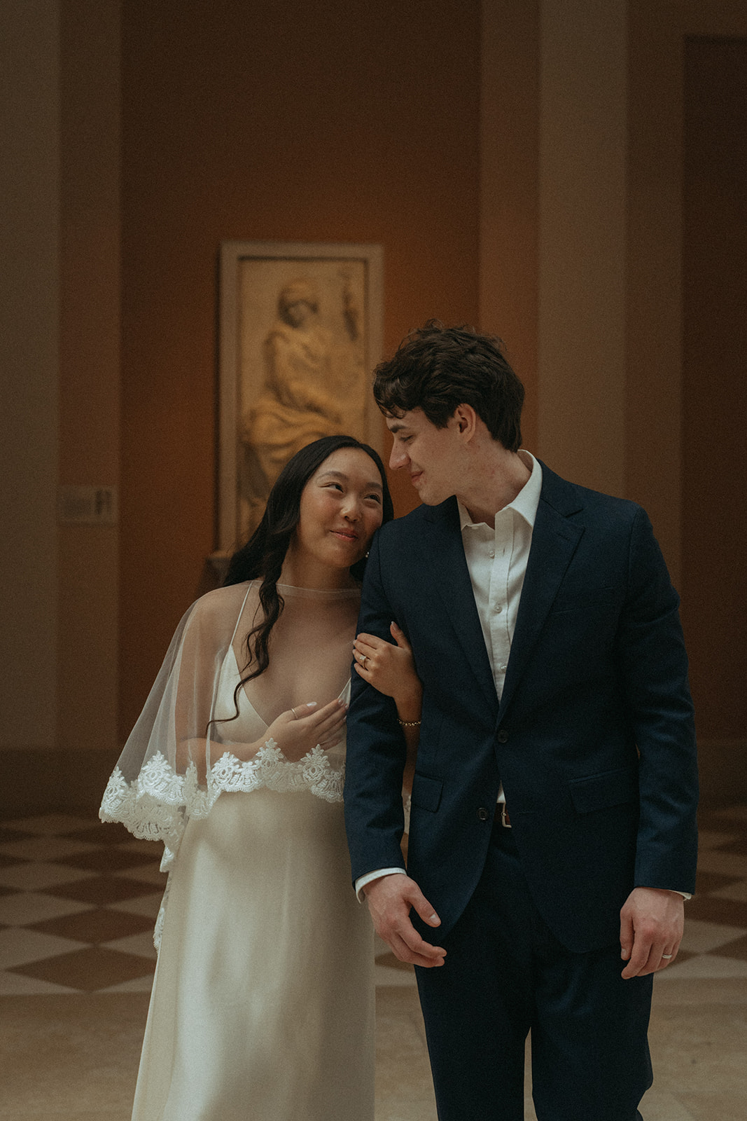 Alex + Bardo NYC Elopement Photos bride and groom walking in the Met for elopement photos, shot by elsie goodman, a destination, wedding and NYC elopement photographer