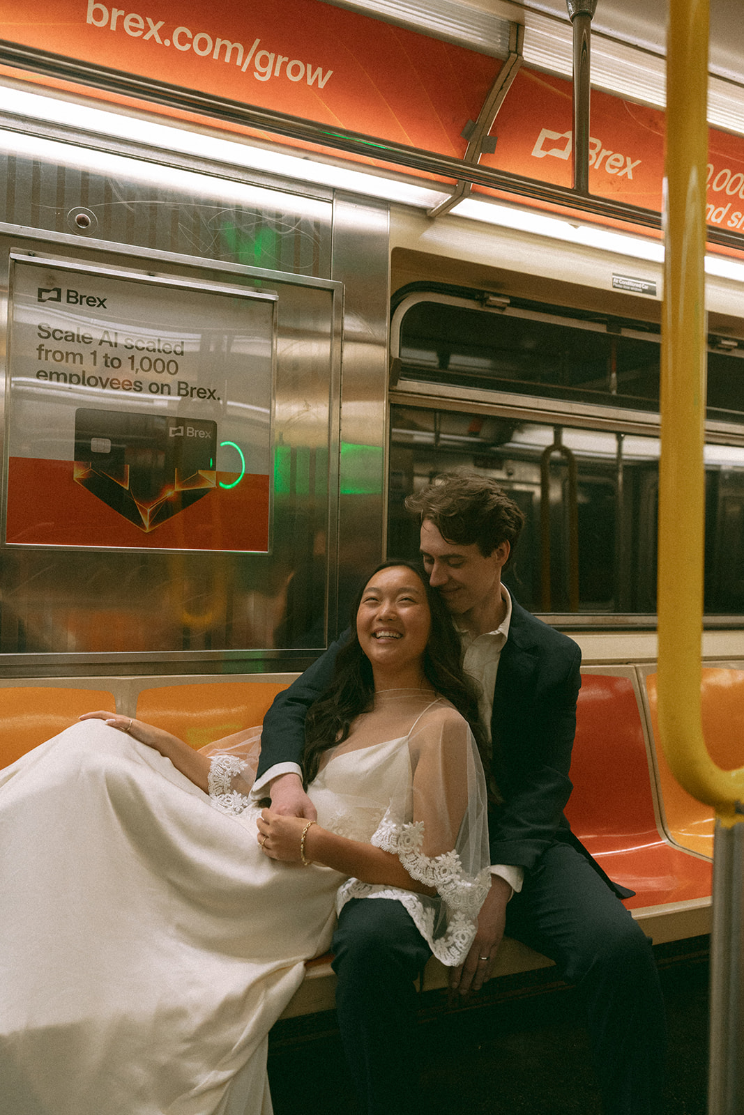 Alex + Bardo NYC Elopement Photos bride and groom sitting on nyc subway to city hall elopement, shot by elsie goodman, a destination, wedding and NYC elopement photographer
