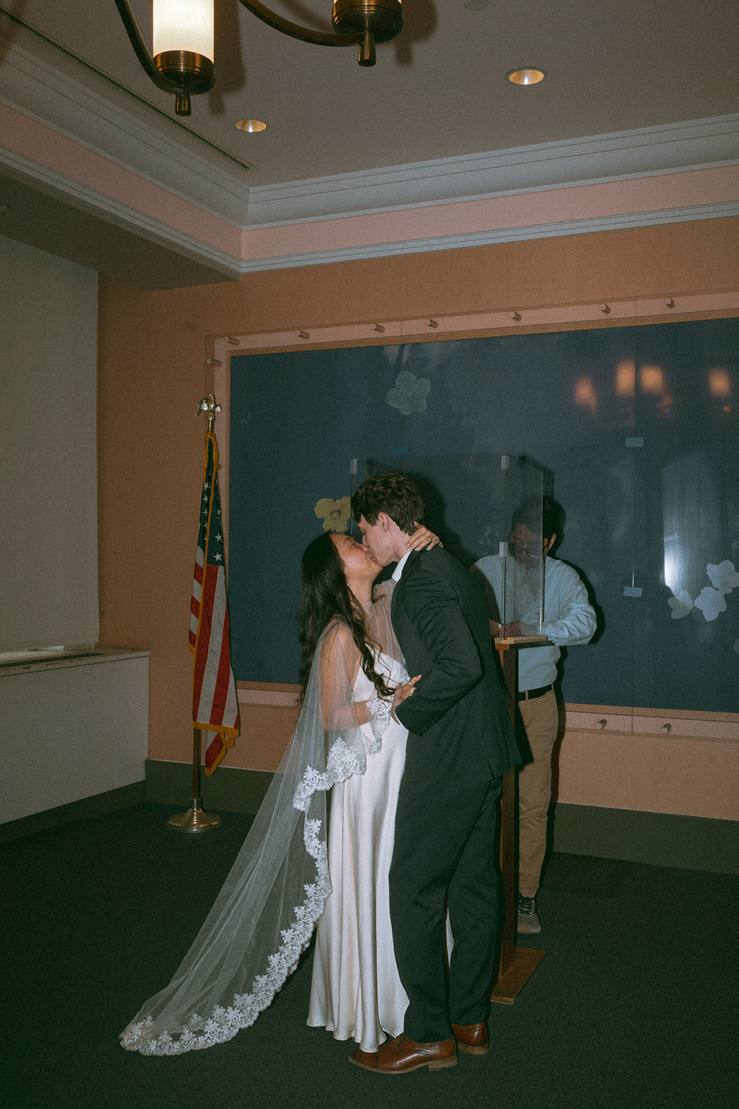 Alex + Bardo NYC Elopement Photos bride and groom's first kiss while eloping at nyc city hall, shot by elsie goodman, a destination, wedding and NYC elopement photographer