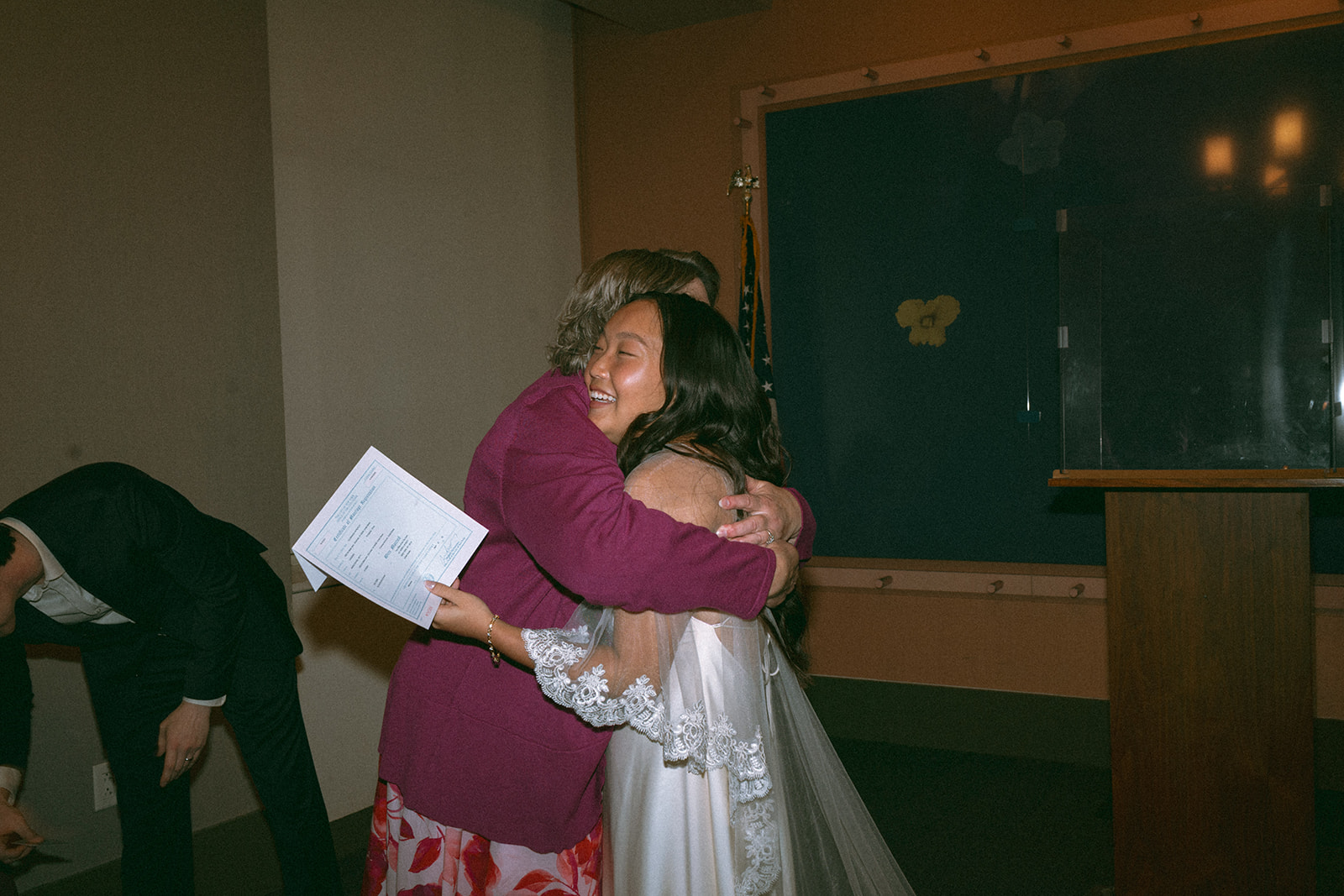 Alex + Bardo NYC Elopement Photos bride hugging loved one at nyc city hall wedding, shot by elsie goodman, a destination, wedding and NYC elopement photographer