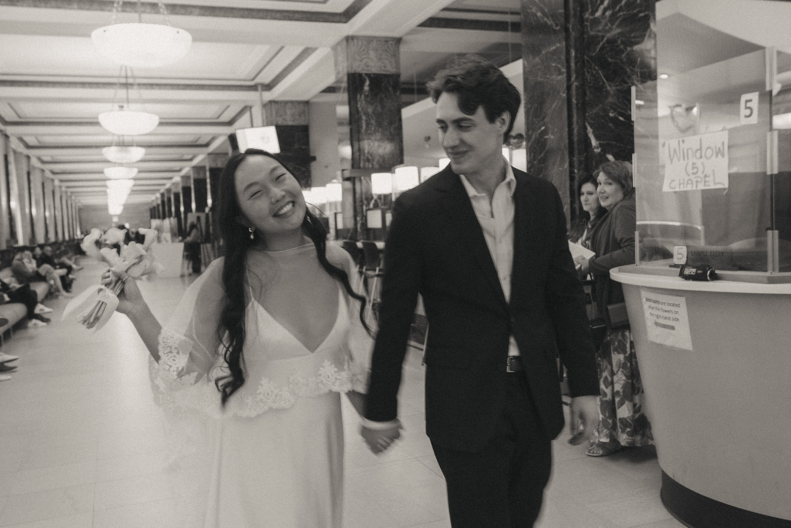 Alex + Bardo NYC Elopement Photos bride and groom walking in city hall after eloping, shot by elsie goodman, a destination, wedding and NYC elopement photographer