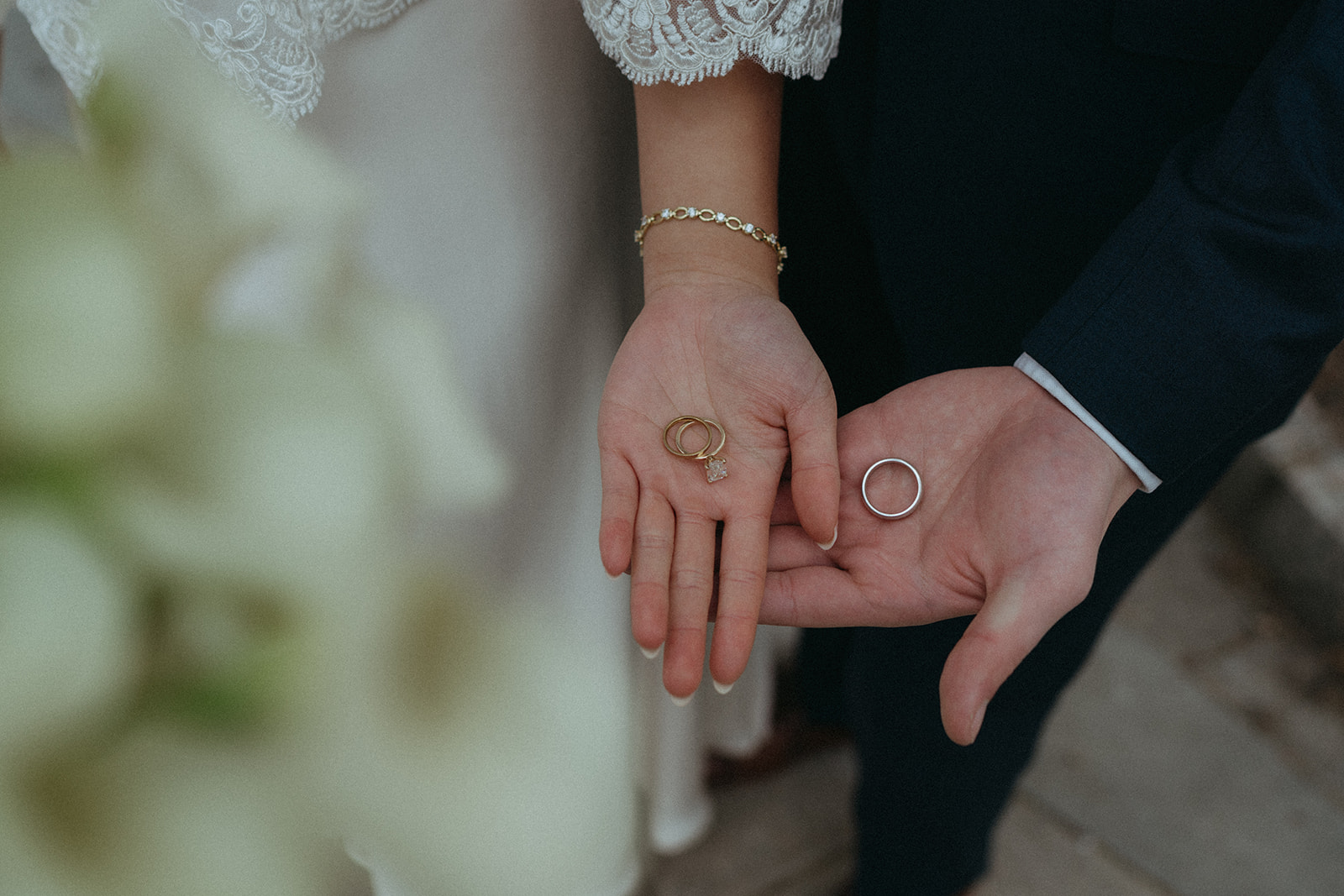 Alex + Bardo NYC Elopement Photos bride and groom's hands holding rings after nyc city hall elopement, shot by elsie goodman, a destination, wedding and NYC elopement photographer
