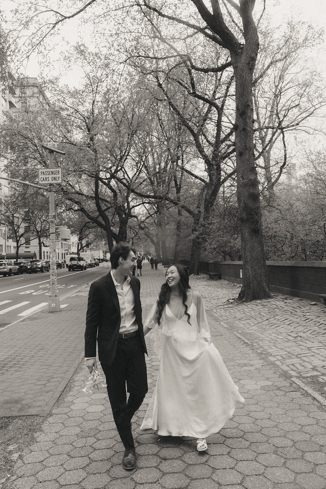 Alex + Bardo NYC Elopement Photos bride and groom walking on street in NYC for elopement photos, shot by elsie goodman, a destination, wedding and NYC elopement photographer