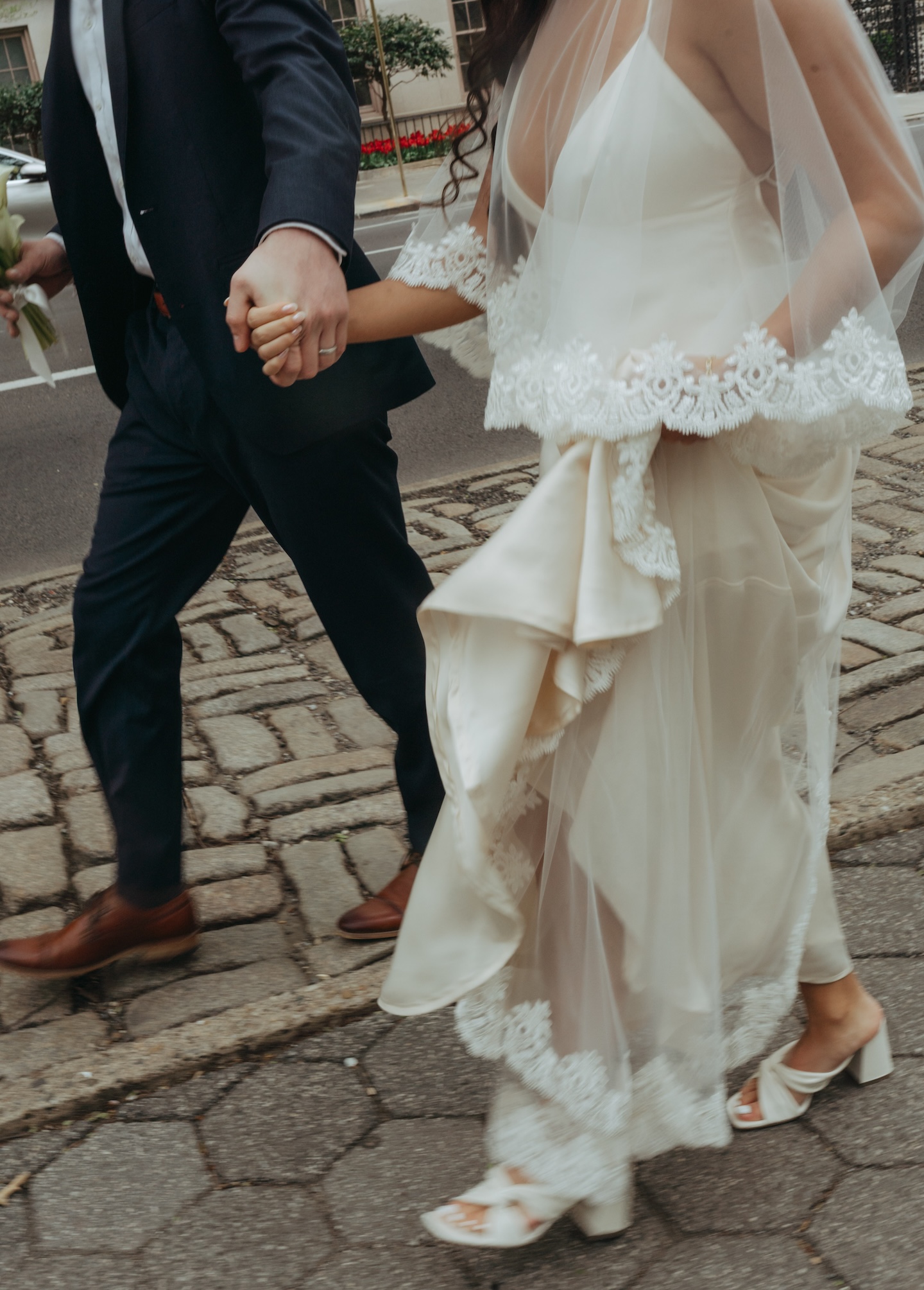 Newlyweds walking on a Manhattan street after their elopement